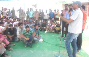 Contract workers blockade gate demanding overdue payment