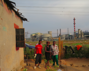 Chali Lumbwe and her family, Kankoyo. With rotten metal roof sheets.